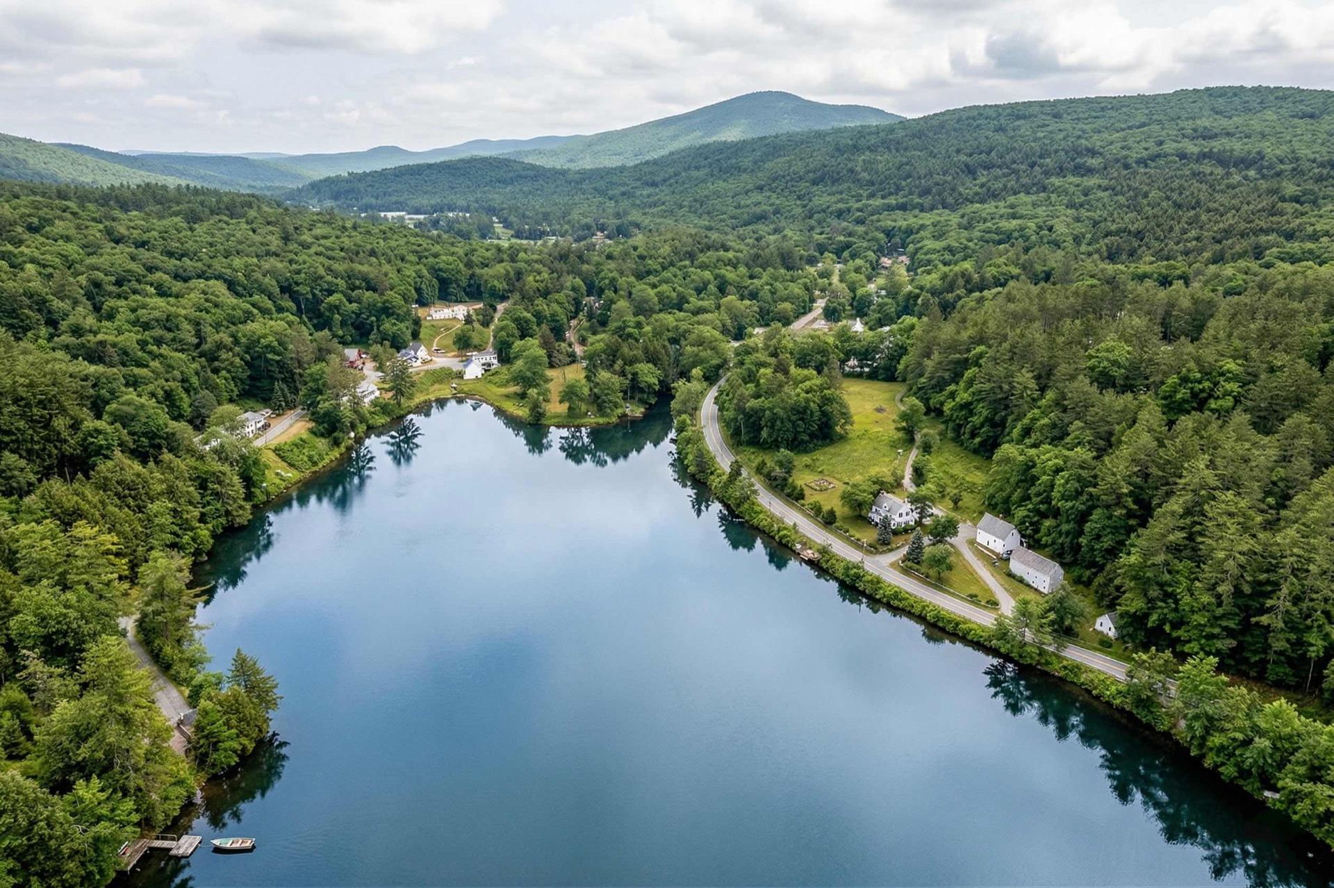 Aerial view of Echo Lake with AJ Farm nestled at the lower right, framed by Vermont's Green Mountains